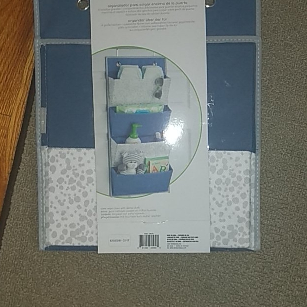 New in plastic over the door organizer